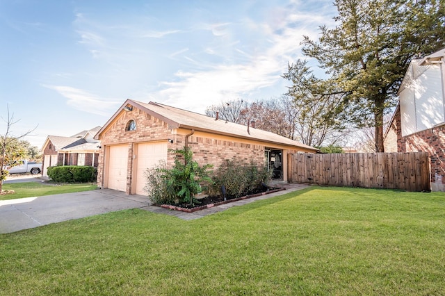 ranch-style home featuring a front yard and a garage