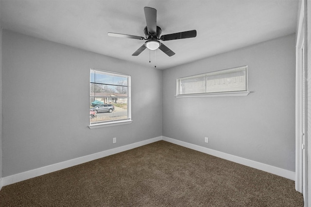 empty room featuring carpet floors and ceiling fan