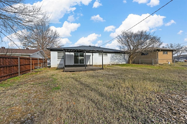 back of house featuring a yard and a patio