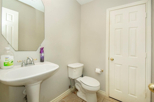 bathroom with sink, tile patterned floors, and toilet