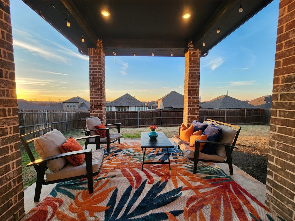 view of patio terrace at dusk