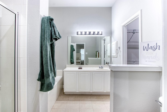 bathroom featuring vanity, tile patterned flooring, and an enclosed shower