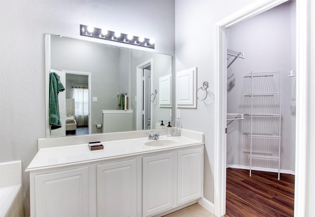 bathroom with vanity and hardwood / wood-style floors