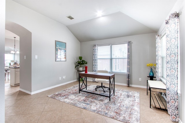 office with light tile patterned floors, vaulted ceiling, and a notable chandelier