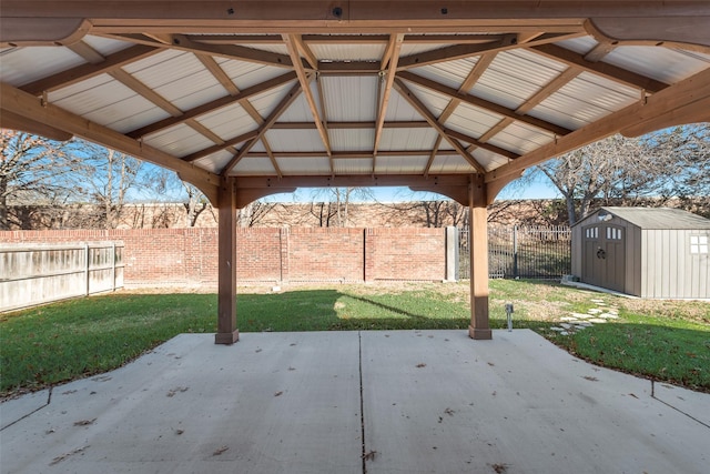 view of patio featuring a storage shed and a gazebo