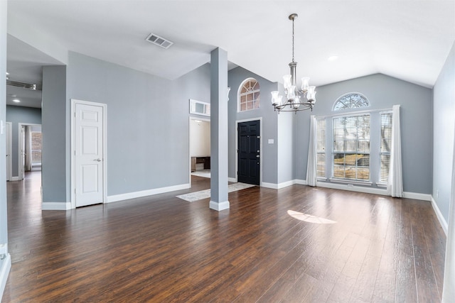 unfurnished living room with an inviting chandelier, dark hardwood / wood-style flooring, and high vaulted ceiling