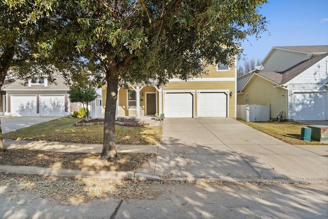 view of front facade featuring a front yard and a garage