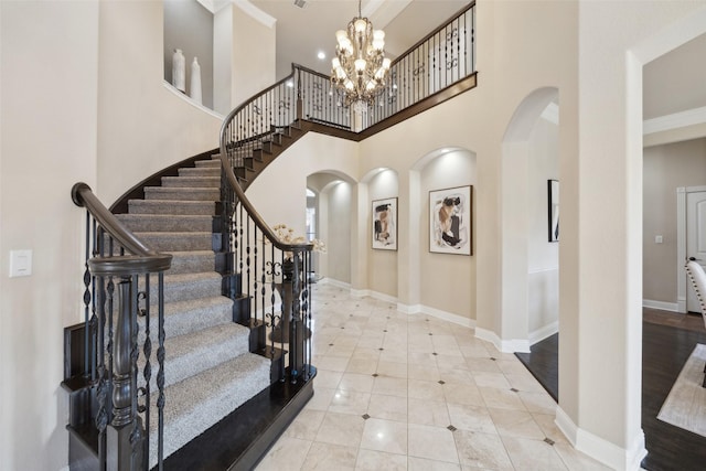 entrance foyer featuring a high ceiling and a chandelier