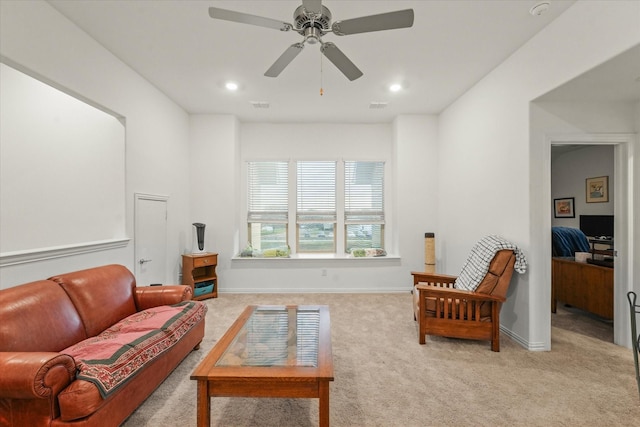 living room with light carpet and ceiling fan