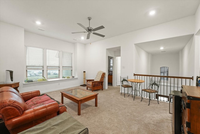 living room featuring ceiling fan and light colored carpet