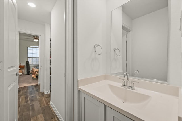 bathroom featuring ceiling fan and vanity