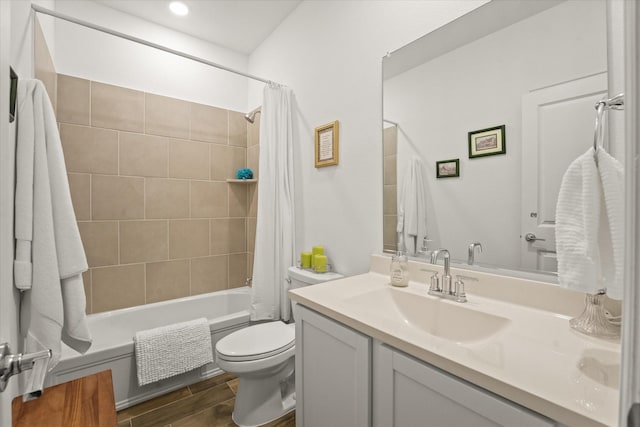 full bathroom with toilet, vanity, and shower / tub combo with curtain