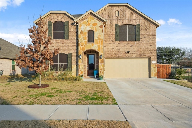 view of front of property with a garage and a front lawn