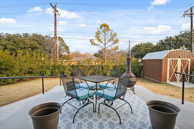 view of patio with a shed