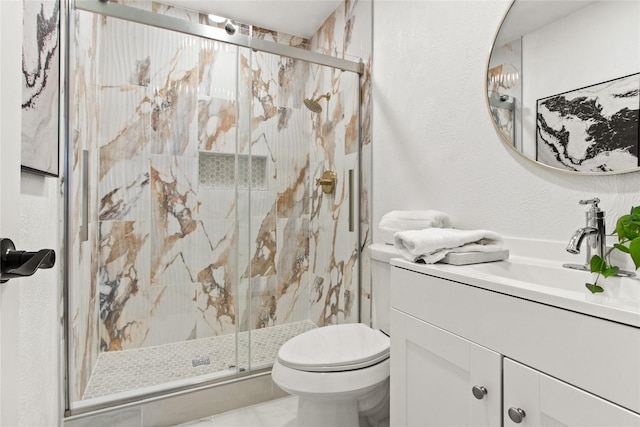 bathroom featuring toilet, an enclosed shower, and vanity