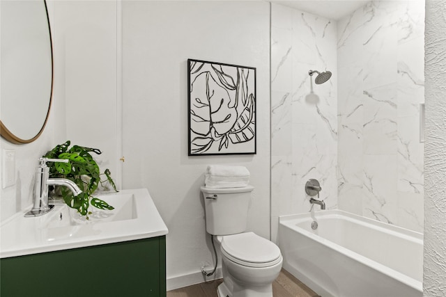 full bathroom featuring toilet, vanity, and tiled shower / bath