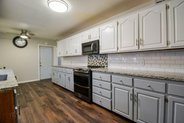 kitchen featuring tasteful backsplash, dark hardwood / wood-style flooring, dishwasher, white cabinets, and sink