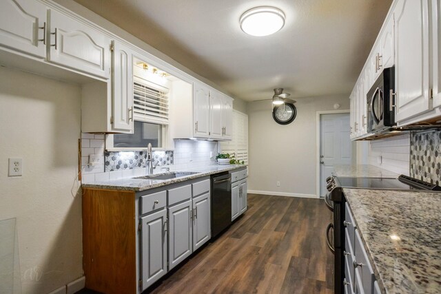 kitchen with appliances with stainless steel finishes, dark hardwood / wood-style floors, backsplash, light stone countertops, and white cabinets