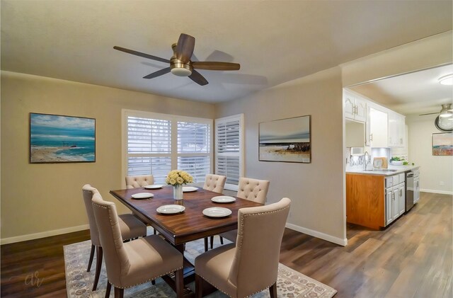 kitchen with white cabinets, dark wood-type flooring, stainless steel appliances, tasteful backsplash, and ceiling fan