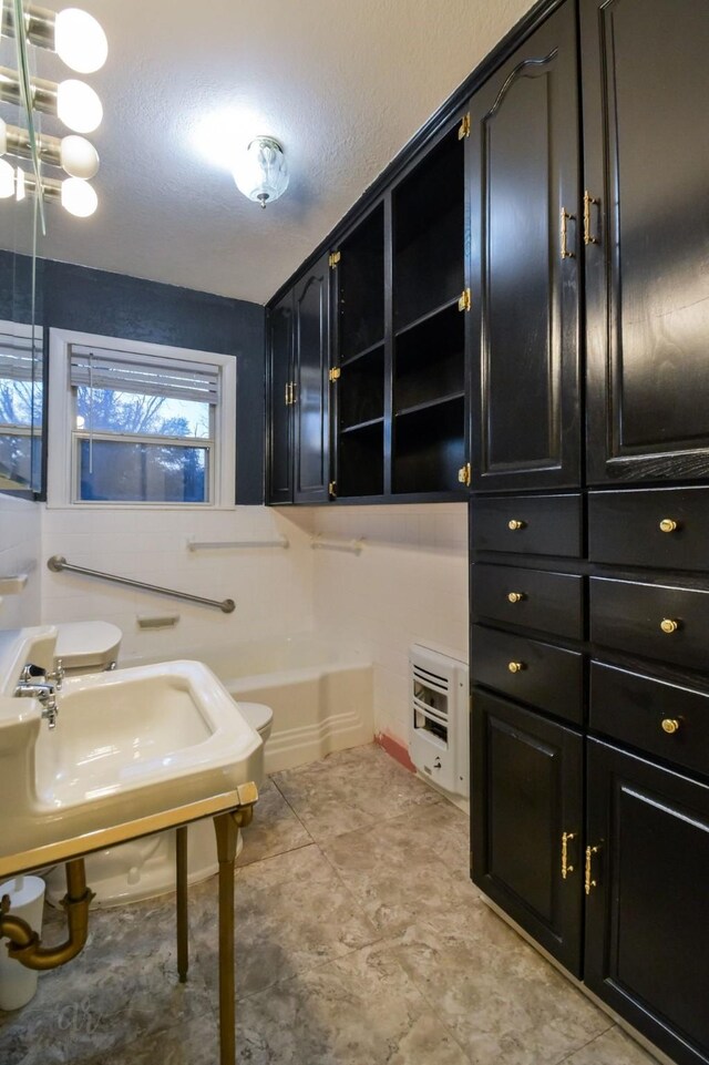 kitchen with white cabinetry, black electric range oven, and dishwasher