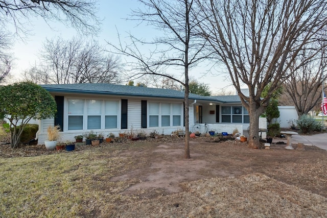 ranch-style house with a front yard