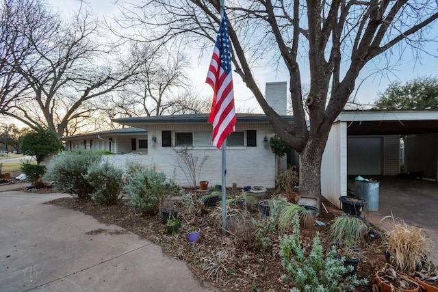 view of front of property with a carport