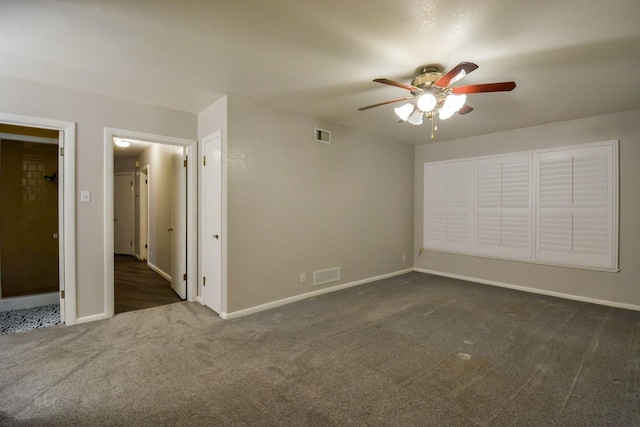 unfurnished bedroom with ceiling fan and dark colored carpet