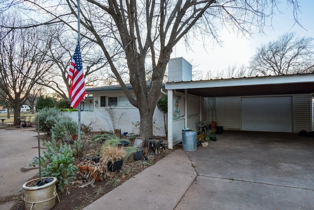 view of front facade with a carport