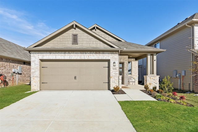 view of front facade with a garage and a front lawn