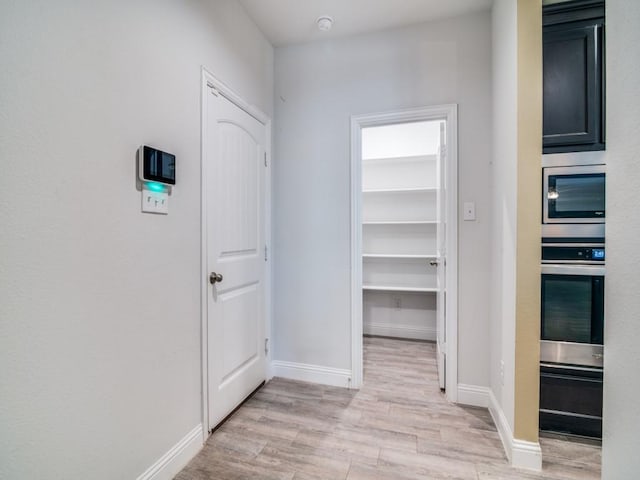 hall featuring light hardwood / wood-style floors