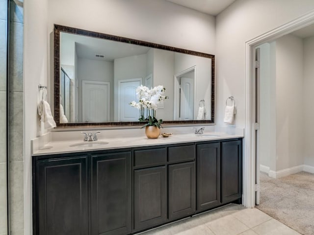 bathroom featuring tile patterned flooring and vanity