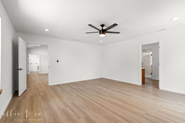 empty room featuring ceiling fan and light hardwood / wood-style floors