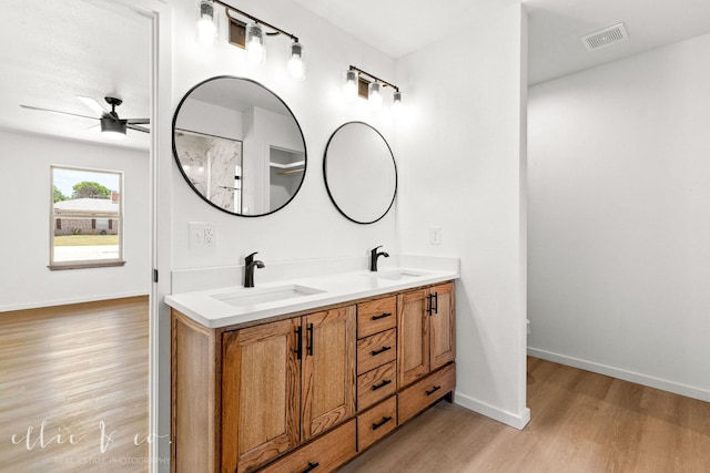 bathroom with ceiling fan, hardwood / wood-style floors, toilet, and vanity