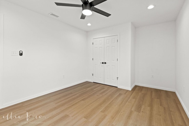 unfurnished room with ceiling fan and light hardwood / wood-style floors