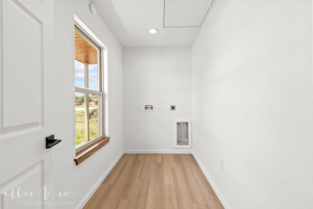 laundry area with hookup for an electric dryer, hookup for a washing machine, and light hardwood / wood-style floors