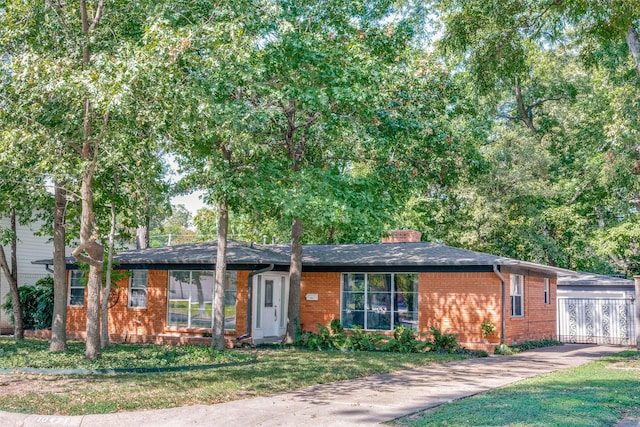 ranch-style home with a front lawn