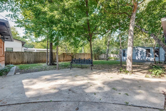 view of patio featuring a storage shed