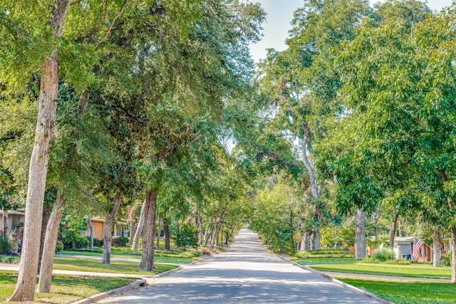 view of property's community with a lawn