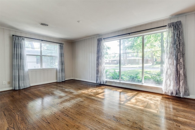 empty room with dark hardwood / wood-style floors