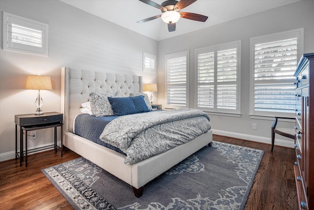 bedroom with ceiling fan and dark hardwood / wood-style flooring