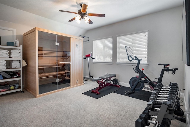 workout area with vaulted ceiling, ceiling fan, and carpet