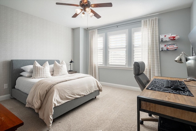 bedroom featuring ceiling fan and carpet