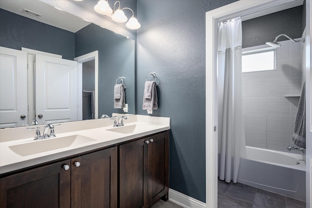 bathroom featuring vanity and shower / tub combo with curtain