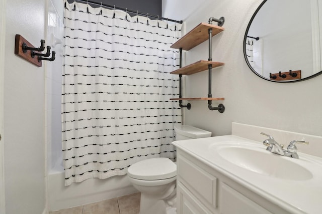 full bathroom with shower / tub combo, vanity, tile patterned floors, and toilet