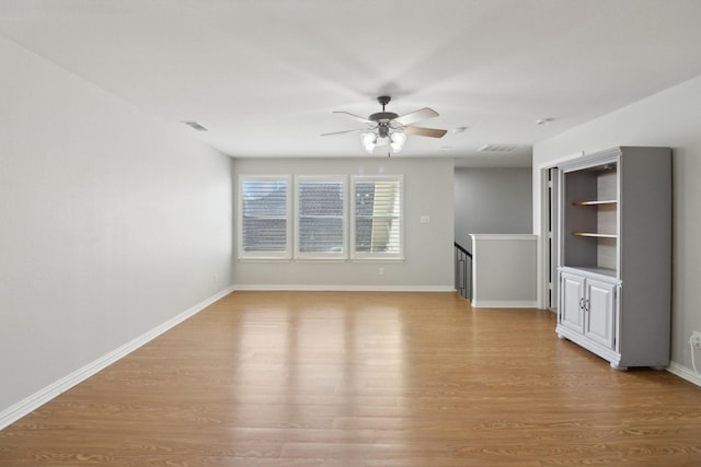 unfurnished living room with ceiling fan and light hardwood / wood-style flooring