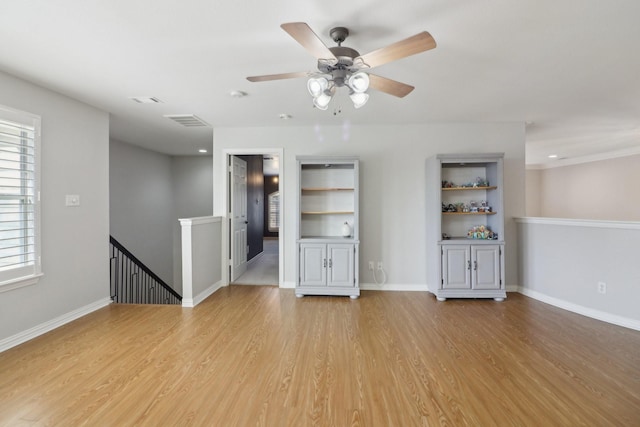 unfurnished room with light wood-type flooring