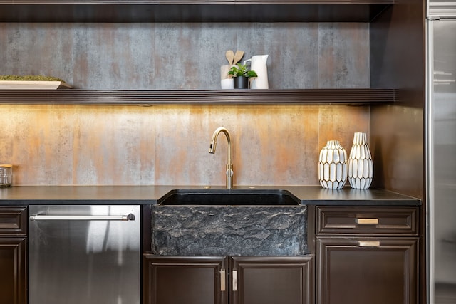 kitchen featuring sink, dark brown cabinetry, and stainless steel appliances