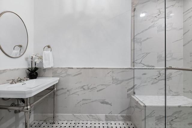 bathroom featuring tile walls, tile patterned floors, and sink