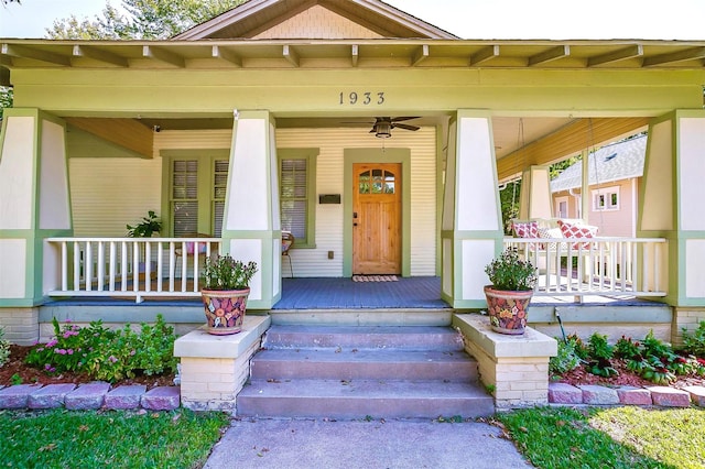 doorway to property featuring ceiling fan and covered porch