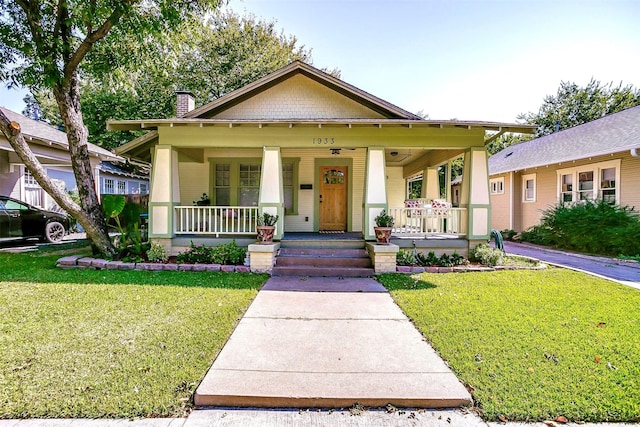 view of front of house with a front lawn and a porch